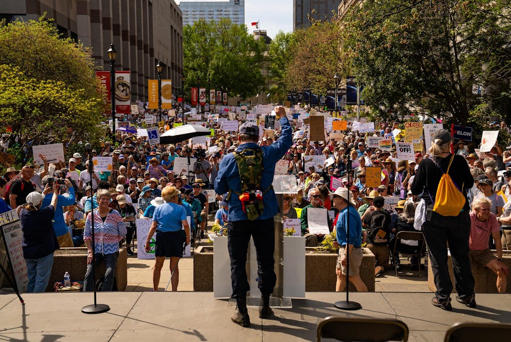 large crowd in Bicentennial Plaza, Raleigh, listens to speaker